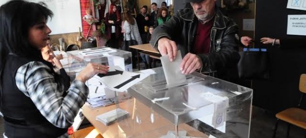 Electoral officer looks on as a man casts his vote (photo credit: Sofia Globe) Electoral officer looks on as a man casts his vote (photo credit: Sofia Globe)