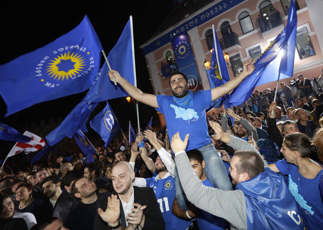 Supporters of the ruling Georgian Dream party celebrate after its win in Oct 2016 (photo credit: AP Photo/Sergei Grits) Supporters of the ruling Georgian Dream party celebrate after its win in Oct 2016 (photo credit: AP Photo/Sergei Grits)