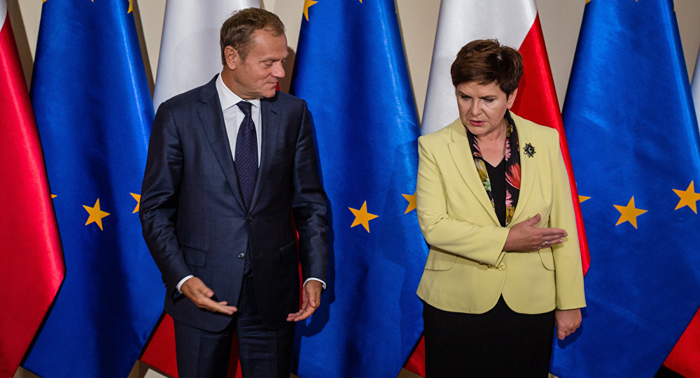 Poland defies EU deadline on changes to constitutional court law Former Polish PM and current president of European Council with current Polish PM (photo credit: AFP / Wojtek Radwanski