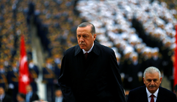 Turkish President Recep Tayyip Erdogan flanked by Prime Minister Binali Yildirim (R) (photo credit: Reuters/Umit Bektas) Turkish President Recep Tayyip Erdogan flanked by Prime Minister Binali Yildirim (R) (photo credit: Reuters/Umit Bektas)