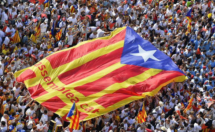 Demonstrators hold pro-independence flag on Catalonia's National Day(photo credit: Gerard Julien/AFP) Demonstrators hold pro-independence flag on Catalonia's National Day(photo credit: Gerard Julien/AFP)