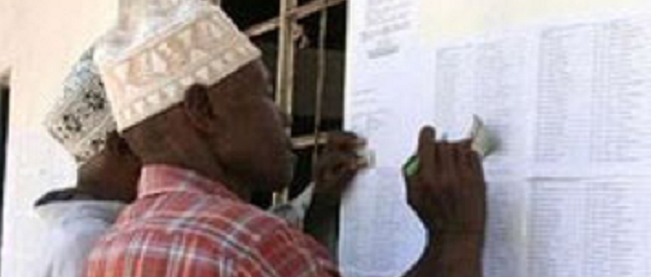 Tanzanians checking for their names Tanzanians checking for their names