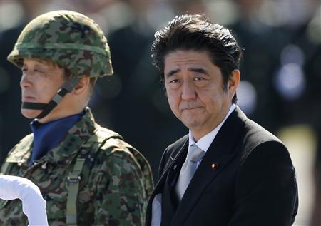 Japanese Prime Minster Shinzo Abe reviews Japan Self-Defence Forces (photo credit: Reuters) Japanese Prime Minster Shinzo Abe reviews Japan Self-Defence Forces (photo credit: Reuters)