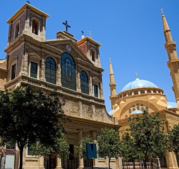 A church and a mosque stand next to each other (Photo credit: Quora) A church and a mosque stand next to each other (Photo credit: Quora)