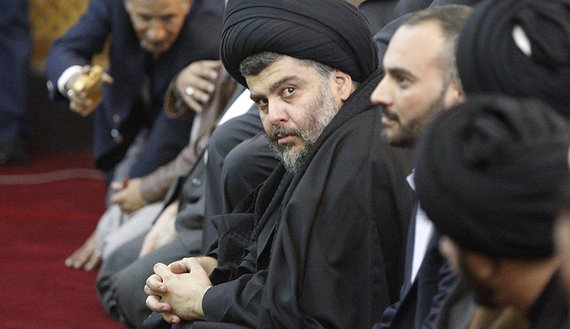 Iraqi Shiite cleric Muqtada al-Sadr (C) takes part in Friday prayers at the Abdul Qadir Gilani Mosque, Baghdad, Jan. 4, 2013. (photo by REUTERS/Thaier Al-Sudani) Iraqi Shiite cleric Muqtada al-Sadr (C) takes part in Friday prayers at the Abdu