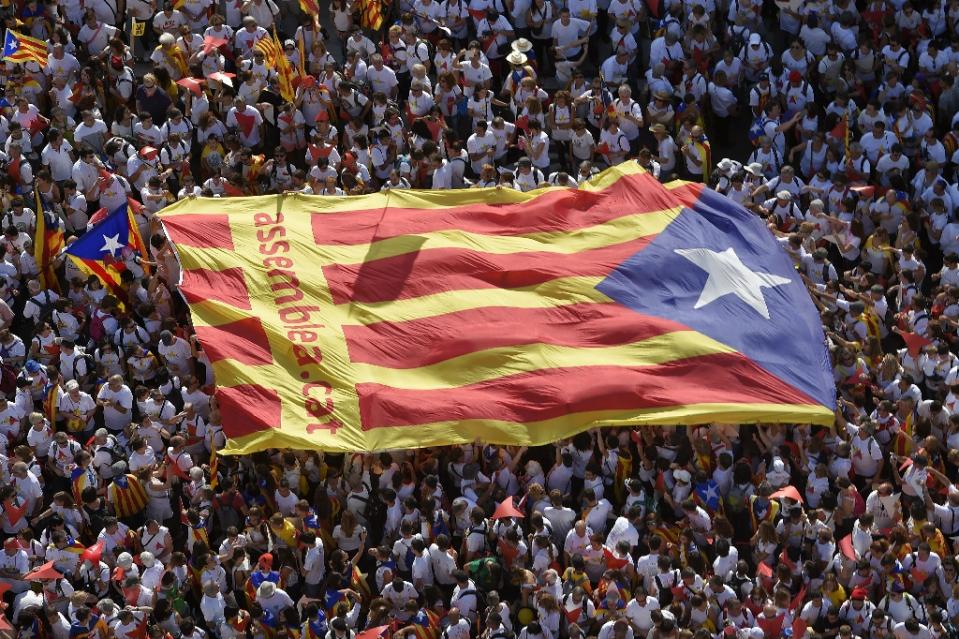 Demonstrators unfold an "Estelada" (pro-independence Catalan flag) during celebrations for Catalonia's National Day in Barcelona on September 11, 2015 (photo credit: AFP) Demonstrators unfold an "Estelada" (pro-independence Catalan flag) during celebrations for Catalonia's National Day in Barcelona on September 11, 2015 (photo credit: AFP)