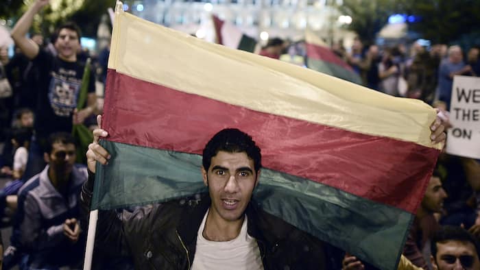 A man holding the flag of the Syrian Kurdish People's Democratic Union Party (PYD) (photo credit: AFP) A man holding the flag of the Syrian Kurdish People's Democratic Union Party (PYD) (photo credit: AFP)