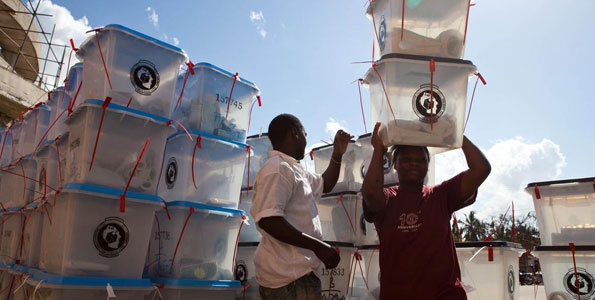 Election officials collect ballot boxes - Tanzanians will go to the polls on October 25, 2015 to elect a new president (photo credit: AFP) Election officials collect ballot boxes - Tanzanians will go to the polls on October 25, 2015 to elect a new president (photo credit: AFP)