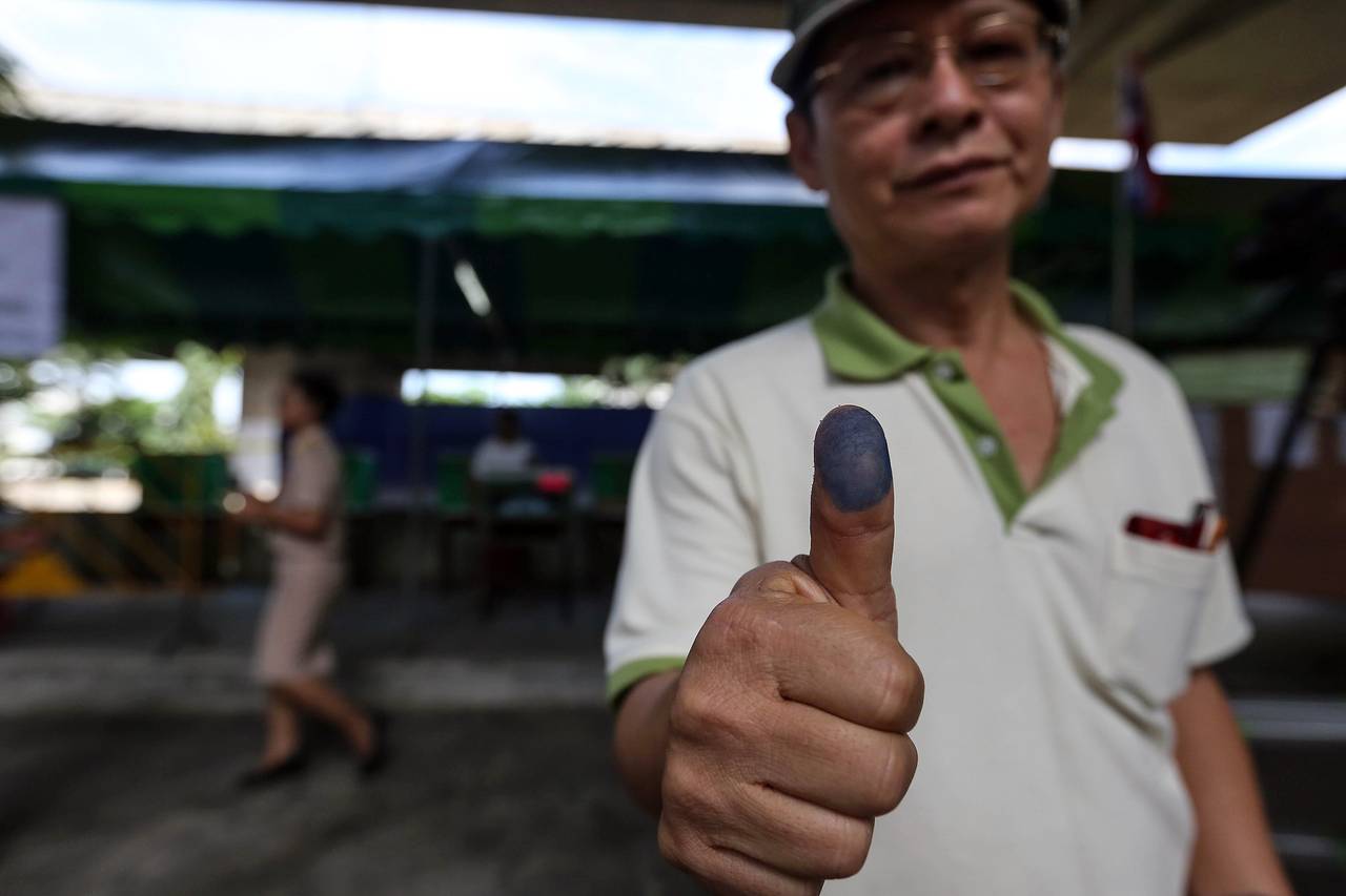A man displays his inked thumb after voting in Thailand's constitutional referendum (photo credit: BLOOMBERG NEWS) A man displays his inked thumb after voting in Thailand's constitutional referendum (photo credit: BLOOMBERG NEWS)