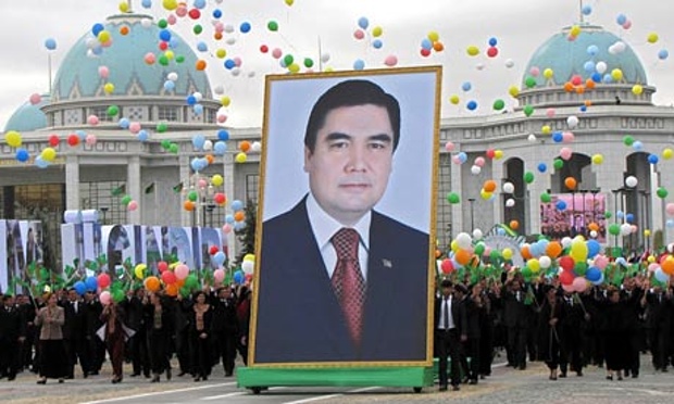 People carry a picture of the Turkmen President Kurbanguly Berdymukhamedov (photo credit: Str/AFP/Getty Images) People carry a picture of the Turkmen President Kurbanguly Berdymukhamedov (photo credit: Str/AFP/Getty Images)
