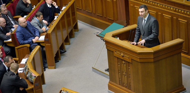 Vitali Klitschko, head of the opposition UDAR party (Ukrainian Democratic Alliance for Reform), right, addresses members of parliament during a parliamentary session in Kiev on Feb. 4, 2014. Photographer: Sergei Supinsky/AFP/Getty Images Vitali Klitschko, head of the opposition UDAR party (Ukrainian Democratic Alliance for Reform), right, addresses members of parliament during a parliamentary session in Kiev on Feb. 4, 2014. Photographer: Sergei Supinsky/AFP/Getty Images