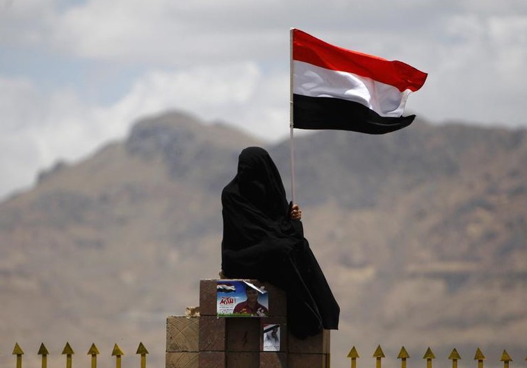 A woman holds the Yemenite national flag (photo credit:REUTERS) A woman holds the Yemenite national flag (photo credit:REUTERS)